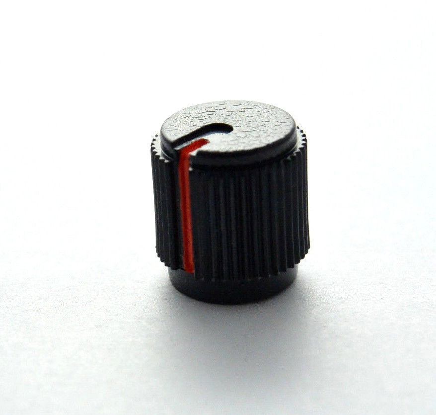 Small black knob with orange indicator – Roland